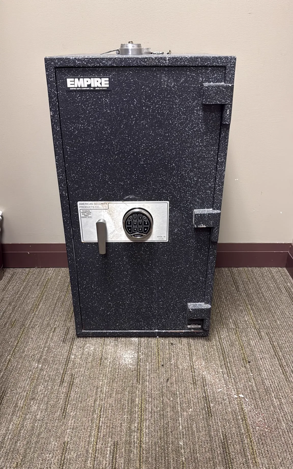 AMSEC commercial safe with electronic keypad installed in an office
