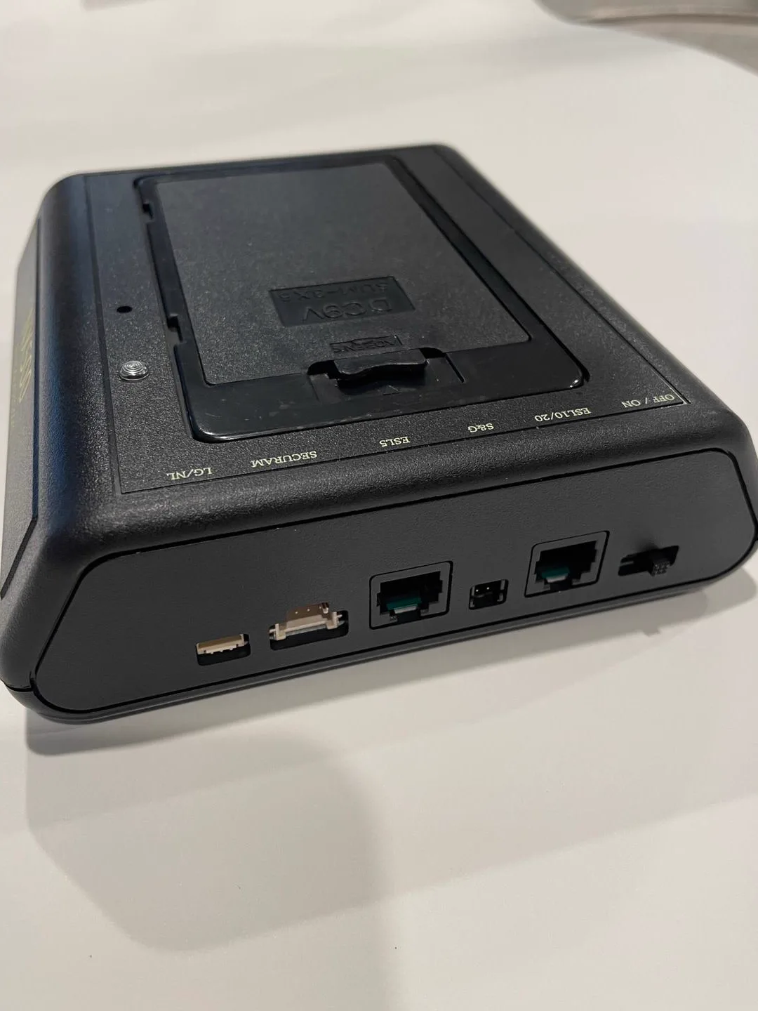 Handheld programming tool connected to an electronic safe lock keypad