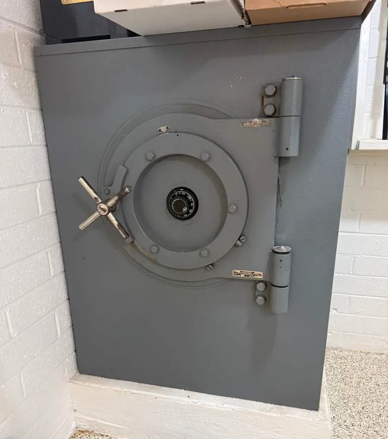 Round steel vault door with exposed locking bolts